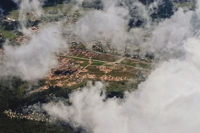 High angle view of smoke emitting from volcanic mountain