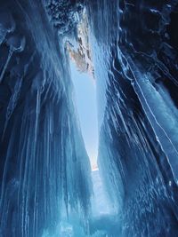 Low angle view of icicles on rock formation