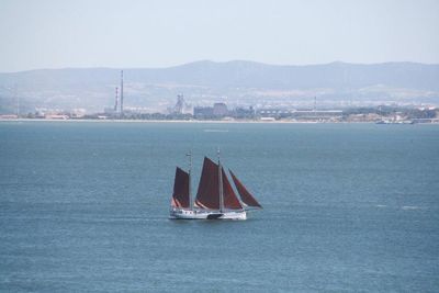 Boats sailing in sea