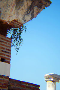 Low angle view of built structure against blue sky