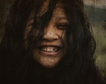 Close-up portrait of a smiling young woman