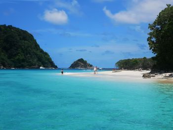 Scenic view of sea against blue sky