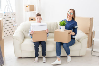 Portrait of a young couple sitting on floor