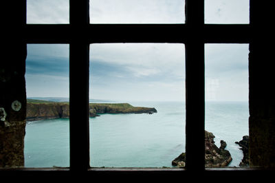 Scenic view of sea seen through window