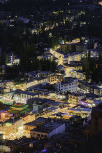 High angle view of illuminated buildings in city at night