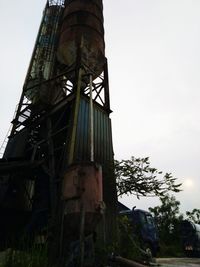 Low angle view of abandoned building against sky