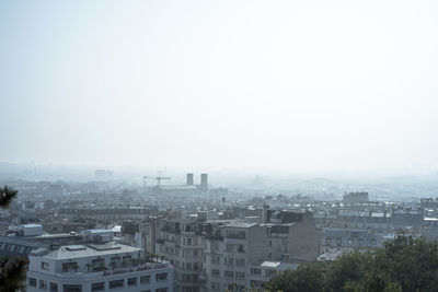 High angle view of buildings in city against sky