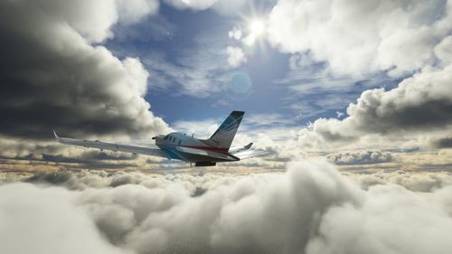 Low angle view of airplane wing against sky