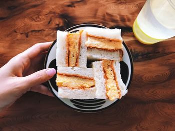 Close-up of hand holding ice cream