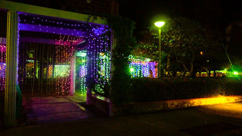 Illuminated street light in building at night