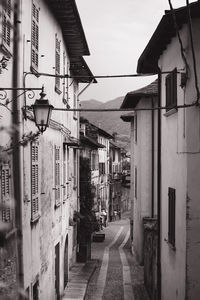 Narrow street amidst buildings in town