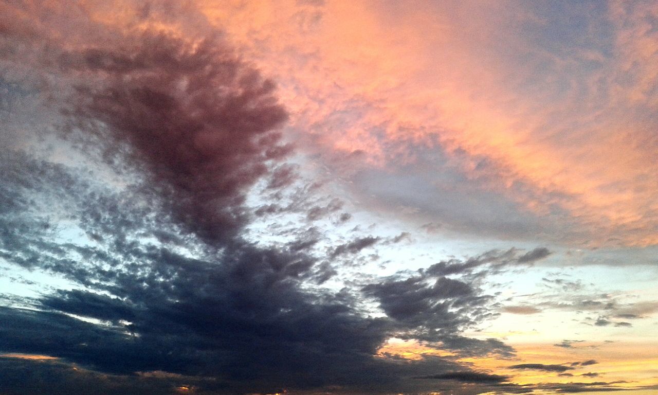 sky, cloud - sky, cloudy, beauty in nature, scenics, sunset, tranquility, low angle view, tranquil scene, nature, weather, dramatic sky, cloudscape, orange color, idyllic, cloud, overcast, backgrounds, atmospheric mood, majestic