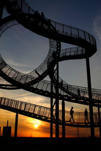 Low angle view of built structure at sunset