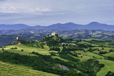 Scenic view of landscape and mountains against sky