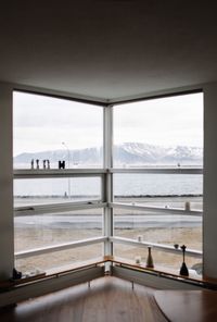 Scenic view of sea seen through window