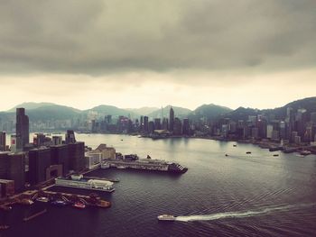 High angle view of bay and buildings against sky