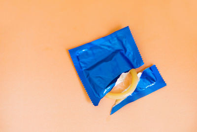 High angle view of blue colored pencils against white background