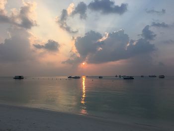 Scenic view of sea against sky at sunset