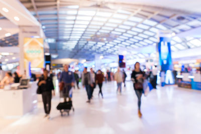 Group of people walking in subway station