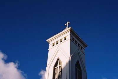 Low angle view of built structure against clear blue sky