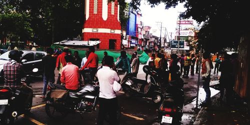 Rear view of people on city street