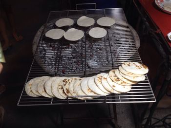 High angle view of meat on barbecue grill