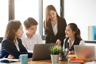 Business colleagues working in office