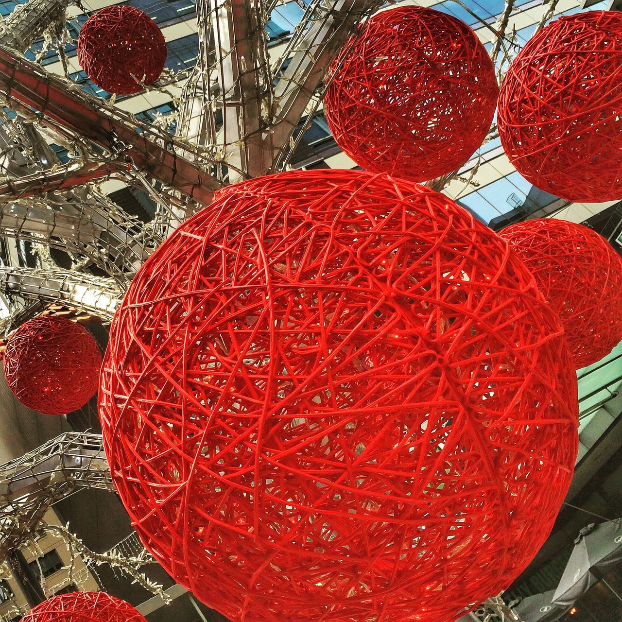 red, indoors, tradition, decoration, food and drink, christmas, close-up, hanging, still life, high angle view, cultures, pattern, celebration, no people, fruit, christmas decoration, architecture, abundance, circle, day