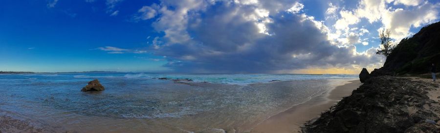 Scenic view of sea against cloudy sky