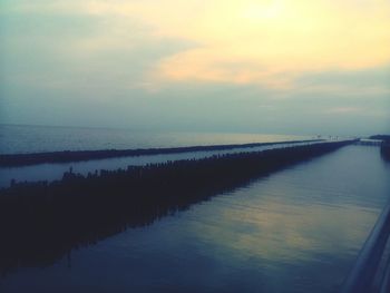 Scenic view of sea against sky at sunset