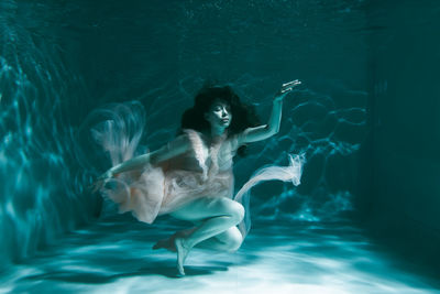 Woman swimming in sea