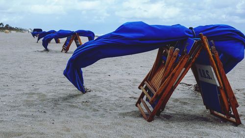 People on beach against sky