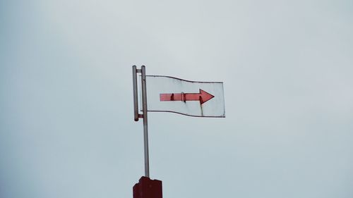 Low angle view of flag against sky