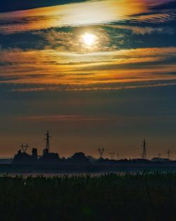 Scenic view of silhouette land against sky during sunset