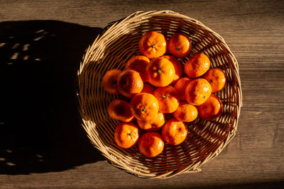 High angle view of fruits in basket on table