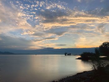 Scenic view of sea against sky at sunset