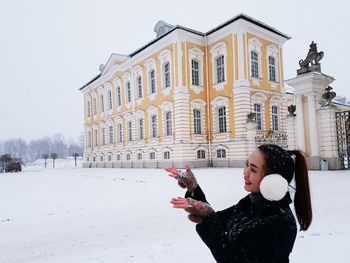 Woman standing in snow