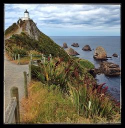 Scenic view of sea against cloudy sky