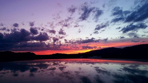 Scenic view of mountains against sky at sunset