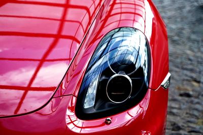 Left side lamp of red porsche boxster.