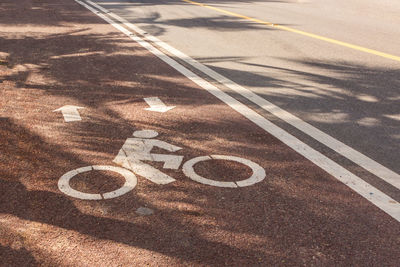 High angle view of bicycle sign on road