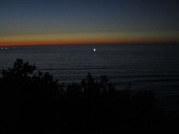 Scenic view of sea against sky at sunset