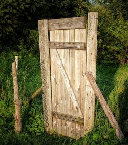 Close-up of wooden post in grass