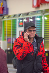 Full length of a man using mobile phone