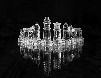 Close-up of chess pieces against black background