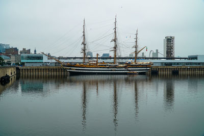 Boats moored at harbor