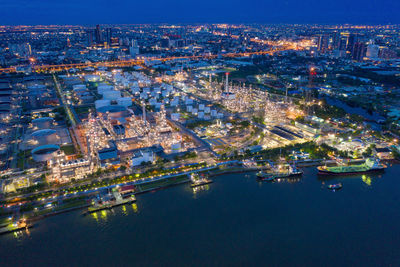 High angle view of city lit up at night