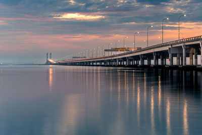 Beautiful sunrise over busy penang bridge, penang, malaysia.