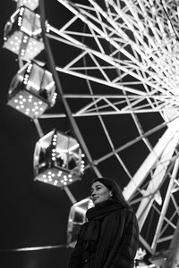 Low angle view of woman in amusement park