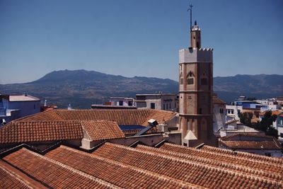View of buildings in town against sky